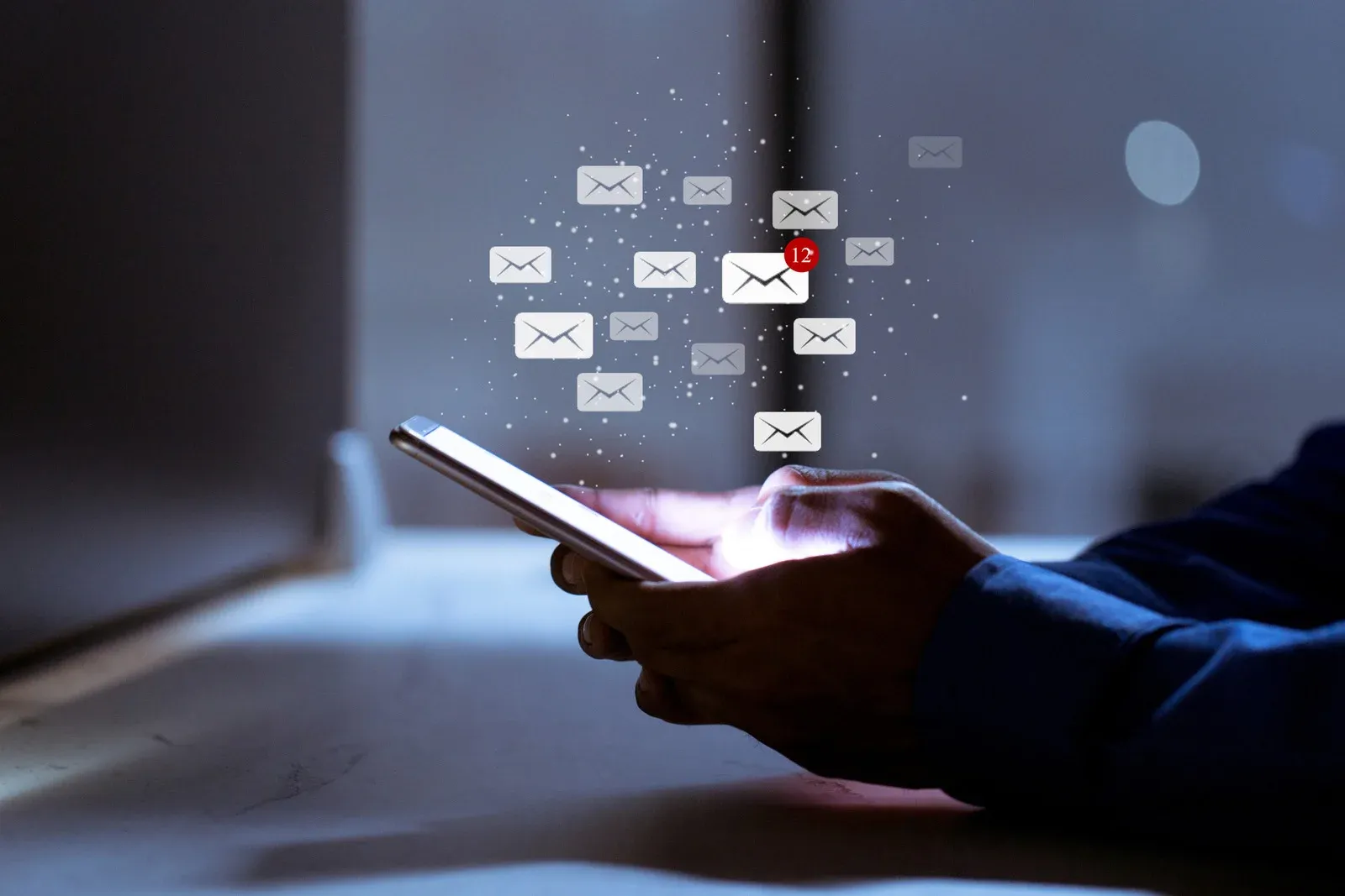 a user holding a mobile phone trying to send emails to his homeowners contact list in calgary a user holding a mobile phone trying to send emails to his homeowners contact list in calgary