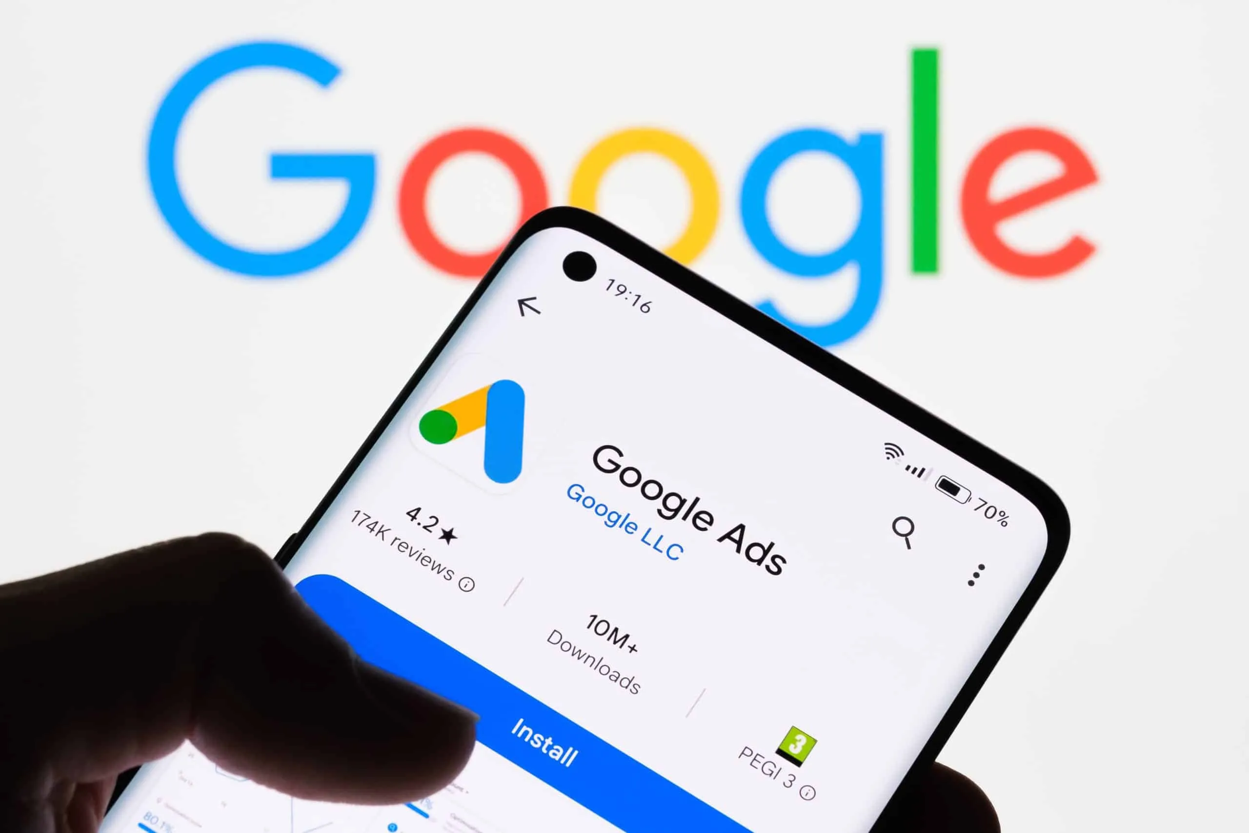 a user with a phone showing up google ads from search engine