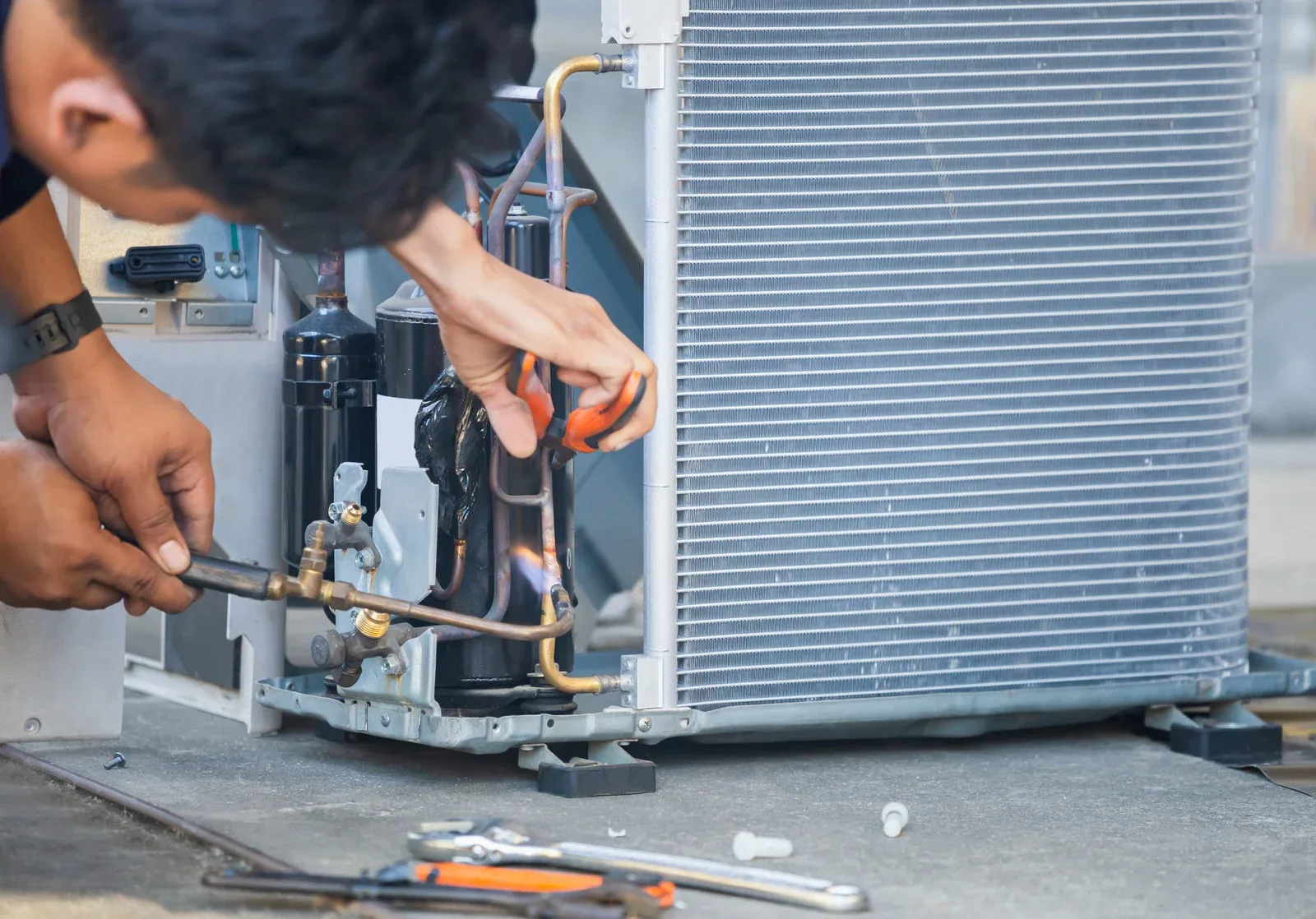 air conditioning repair team using oxygen fuel gases at a home service in calgary alberta 2025