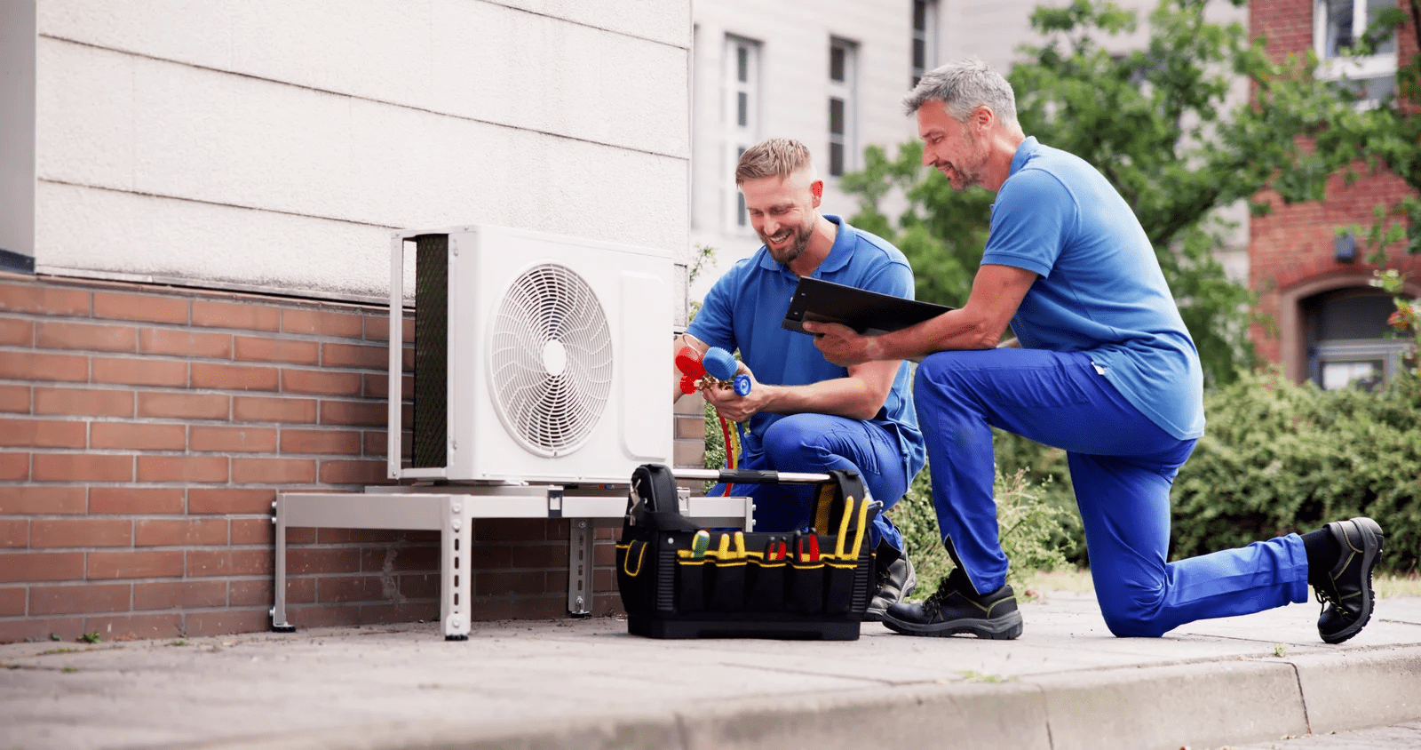 hvac seo in calgary alberta two technicians discussing work progress